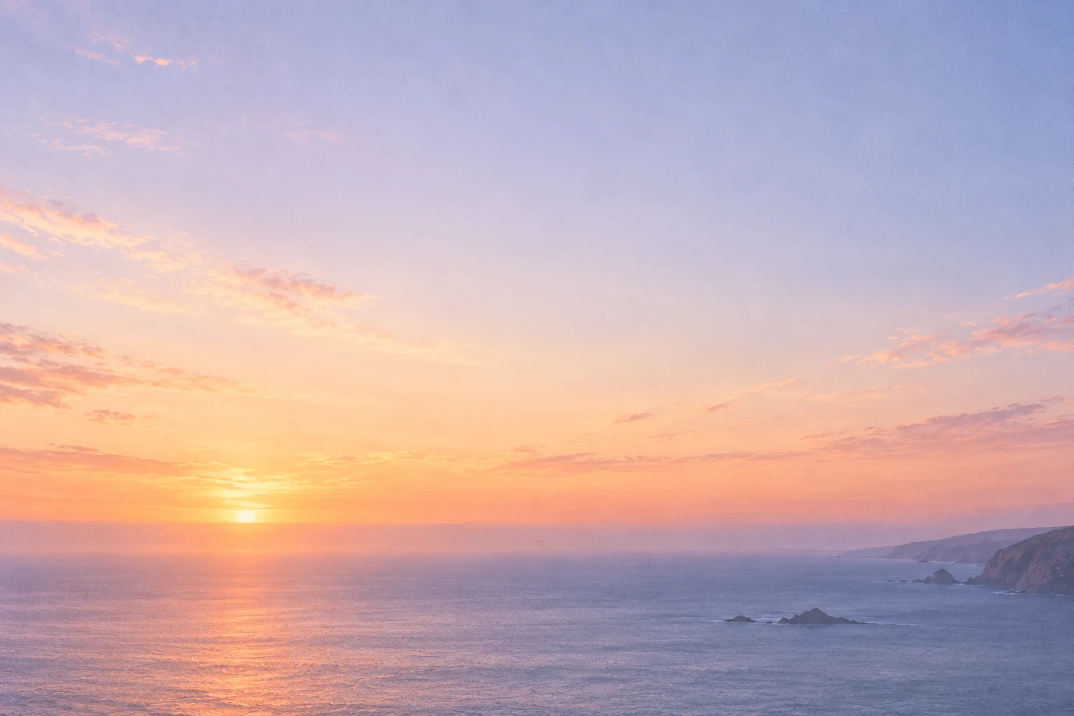 A softly textured lavender and apricot horizon over an open sea
